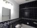 Off hallway and includes new tile and fixtures